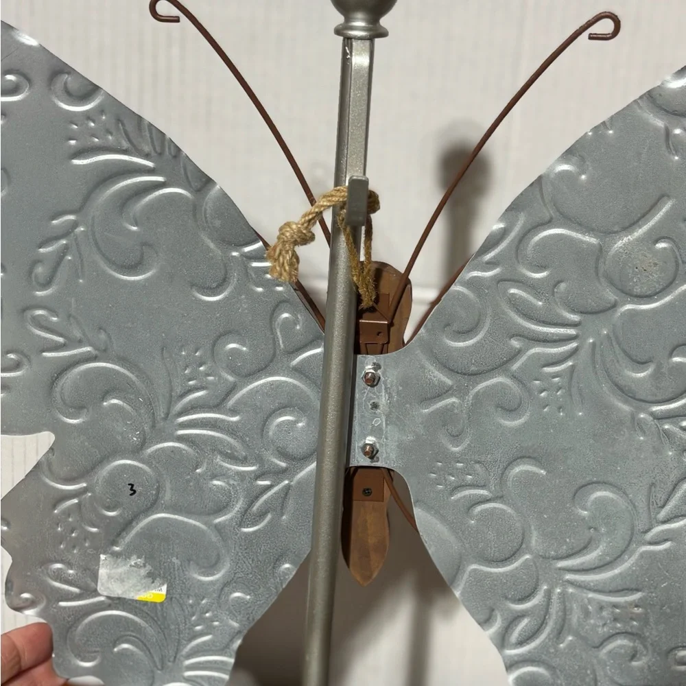 Metal butterfly w/wood accents Hanger on back Perfect for a patio or inside 18.5